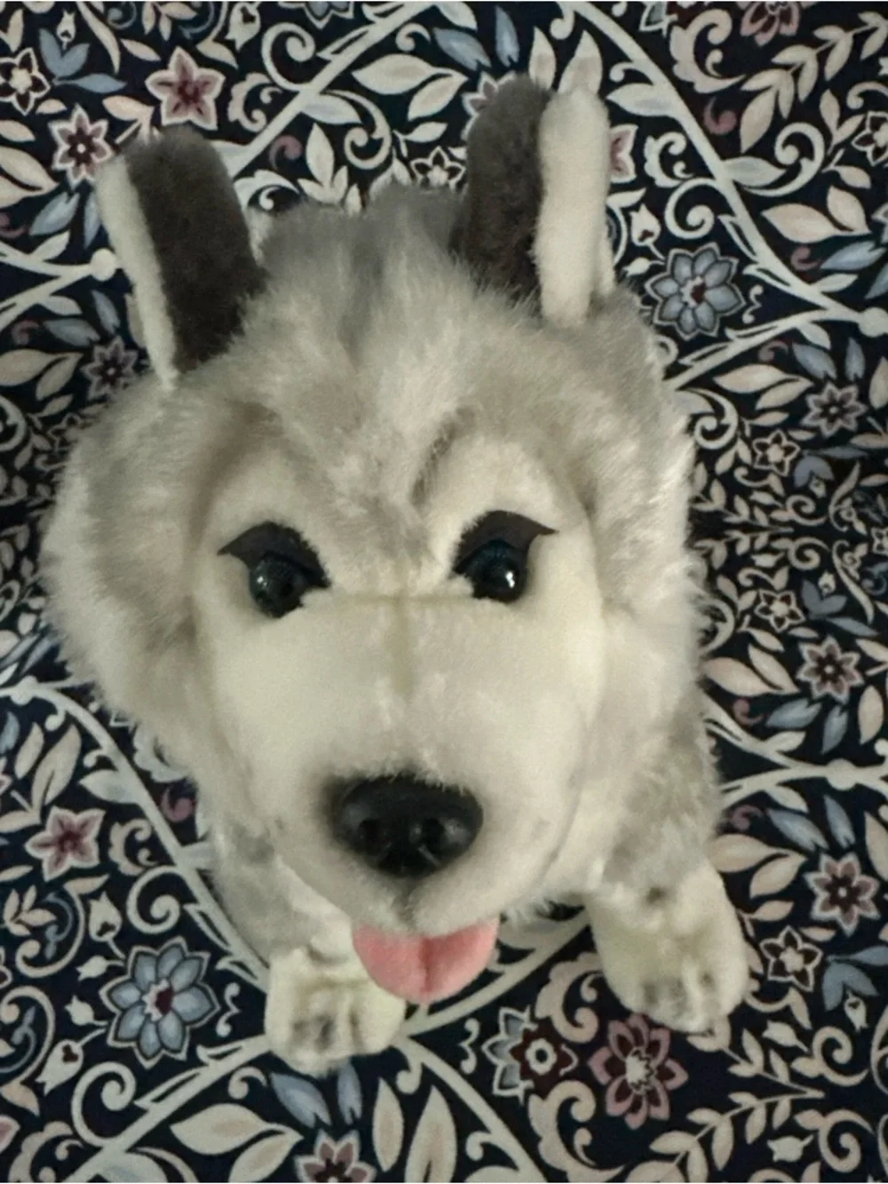 Siberian Husky dog toy with blue eyes and a happy open mouth showing its tongue
